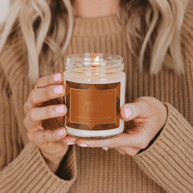 Sweet Water Decor Hello Fall Candle, Autumn Scented Notes of Cider, Cinnamon Cloves, & Nutmeg, 40+ Hour Burn Time, Non-Toxic Soy Wax Blend, Poured in The USA, Cotton Wick, 9oz Glass Jar with Gold Lid
