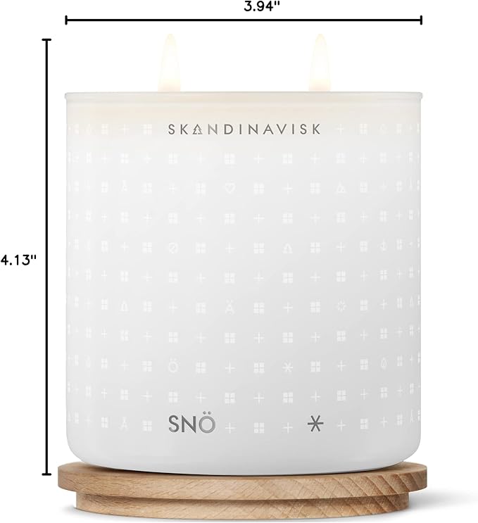 Skandinavisk SNÖ 'Snow' Scented Candle with 2 Wicks. Fragrance Notes: Frozen Forests and Frosted Berries, The Sharp Breath of Subzero Skies. 14.1 oz.