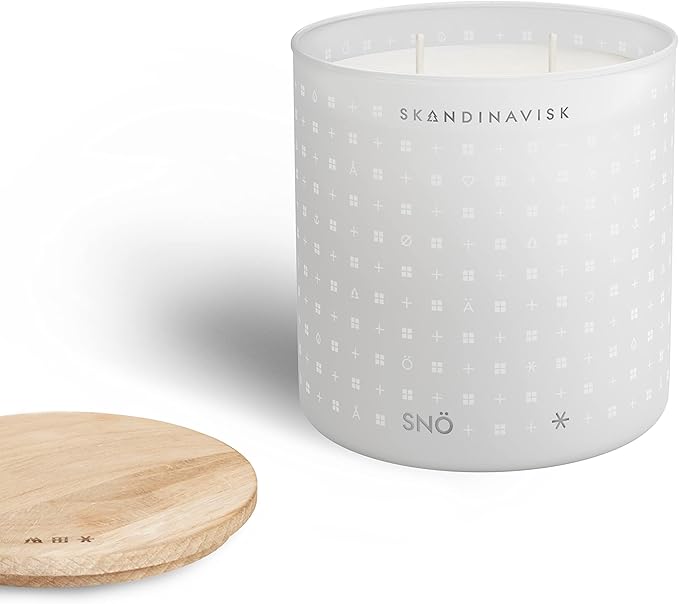 Skandinavisk SNÖ 'Snow' Scented Candle with 2 Wicks. Fragrance Notes: Frozen Forests and Frosted Berries, The Sharp Breath of Subzero Skies. 14.1 oz.