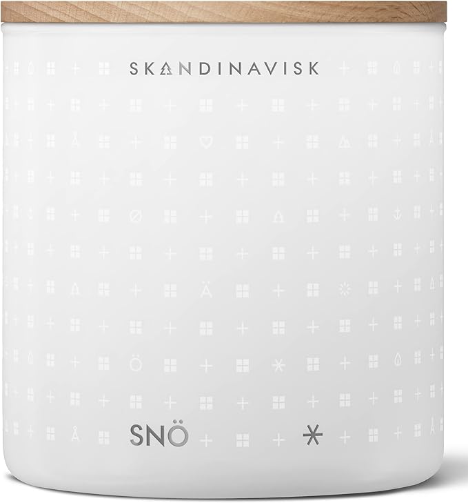 Skandinavisk SNÖ 'Snow' Scented Candle with 2 Wicks. Fragrance Notes: Frozen Forests and Frosted Berries, The Sharp Breath of Subzero Skies. 14.1 oz.