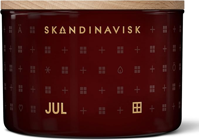 Skandinavisk JUL 'Christmas' Scented Candle. Fragrance Notes: Baked Gingerbread, Winter Cloves and Spiced Oranges. 3.17 oz.