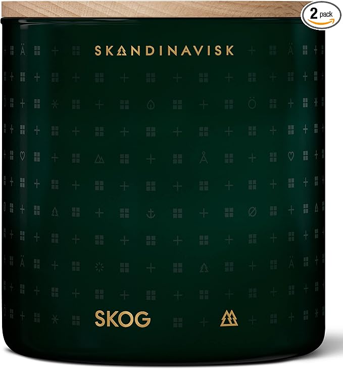Skandinavisk Skog 'Forest' Scented Candle with 2 Wicks. Fragrance Notes: Pine Needles and Fir Cones, Birch Sap and Lily of The Valley. 14.1 oz.