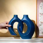 Levvohd Snuggle Hollow Ceramic Vase Set of 2, 8.4 inch Modern Nordic Coastal Shaped Pampas Grass Aesthetic Decorative Table Vases for Home Decor (Matte Navy Blue - M)