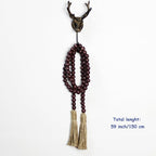 CVHOMEDECO. Wood Beads Garland with Tassels Farmhouse Rustic Wooden Prayer Bead String Wall Hanging Accent for Home Festival Decor. Brown Distressed