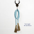 CVHOMEDECO. Wood Beads Garland with Tassels Farmhouse Rustic Wooden Prayer Bead String Wall Hanging Accent for Home Festival Decor. Teal Distressed