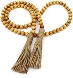 CVHOMEDECO. Wood Grain Beads Garland with Tassels Farmhouse Rustic Wooden Prayer Bead String Wall Hanging Accent for Home Festival Decor. Light Tan