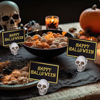 24 Set Halloween Skull Place Card Holders with 48 Pcs Place Cards Resin Small Skull Head Table Number Holders Clips Photo Stand Centerpieces for Halloween Party Wedding Birthday Decorations