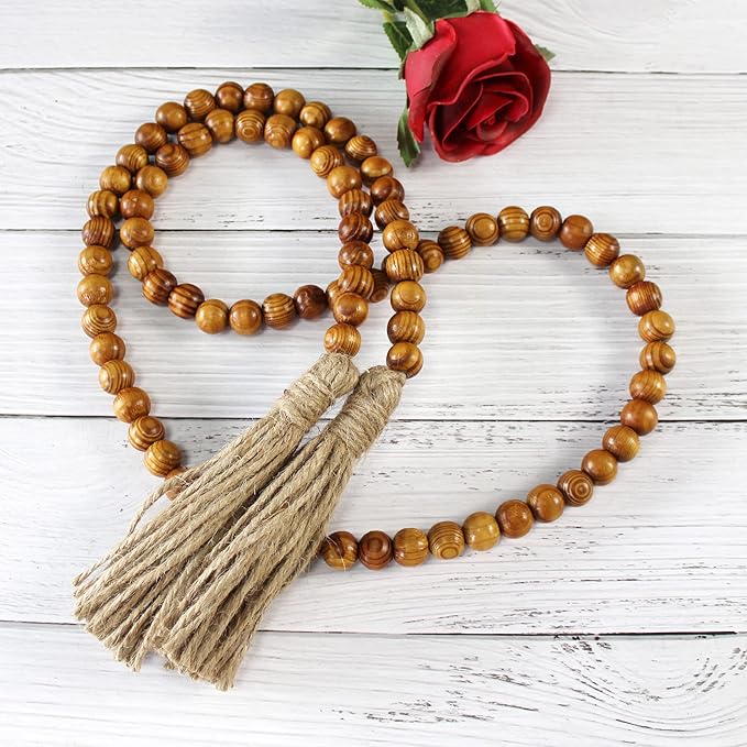 CVHOMEDECO. Wood Grain Beads Garland with Tassels Farmhouse Rustic Wooden Prayer Bead String Wall Hanging Accent for Home Festival Decor. Tan