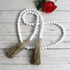 CVHOMEDECO. Wood Beads Garland with Tassels Farmhouse Rustic Wooden Prayer Bead String Wall Hanging Accent for Home Festival Decor. White