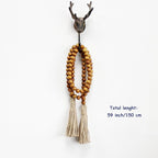 CVHOMEDECO. Wood Grain Beads Garland with Tassels Farmhouse Rustic Wooden Prayer Bead String Wall Hanging Accent for Home Festival Decor. Tan