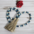 CVHOMEDECO. Wood Beads Garland with Tassels Farmhouse Rustic Wooden Prayer Bead String Wall Hanging Accent for Home Festival Decor. Blue Mix Distressed