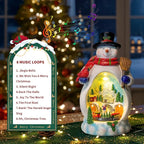 Snowman Figurine Lighted Christmas Village with Animated Rotating Train - Battery or USB Powered Snowman Decor Ornaments, LED Lights & Festive Music for Tabletop Home Holiday Collection Decorations