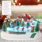 VCUTEKA Christmas Village Houses, Santa Claus with Tree and Rotating Kids Skating Lighted Musical Christmas Village Collectible Building for Xmas Indoor Decorations or Holiday Table Displays