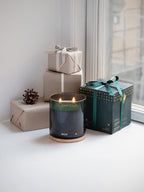 Skandinavisk Skog 'Forest' Scented Candle with 2 Wicks. Fragrance Notes: Pine Needles and Fir Cones, Birch Sap and Lily of The Valley. 14.1 oz.