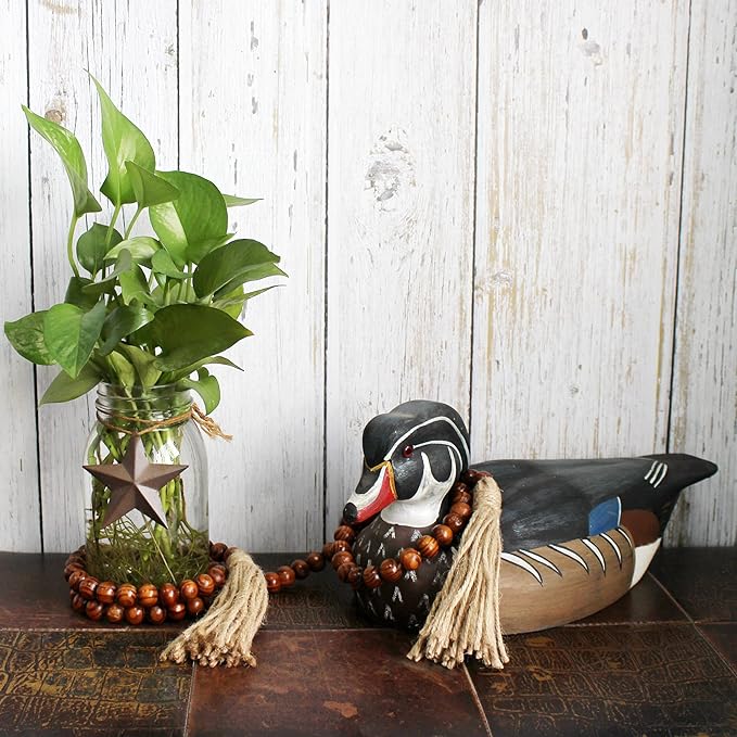 CVHOMEDECO. Wood Grain Beads Garland with Tassels Farmhouse Rustic Wooden Prayer Bead String Wall Hanging Accent for Home Festival Decor. Dark Tan