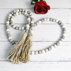 CVHOMEDECO. Wood Beads Garland with Tassels Farmhouse Rustic Wooden Prayer Bead String Wall Hanging Accent for Home Festival Decor. Grey Mix Distressed