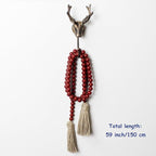 CVHOMEDECO. Wood Beads Garland with Tassels Farmhouse Rustic Wooden Prayer Bead String Wall Hanging Accent for Home Festival Decor. Burgundy