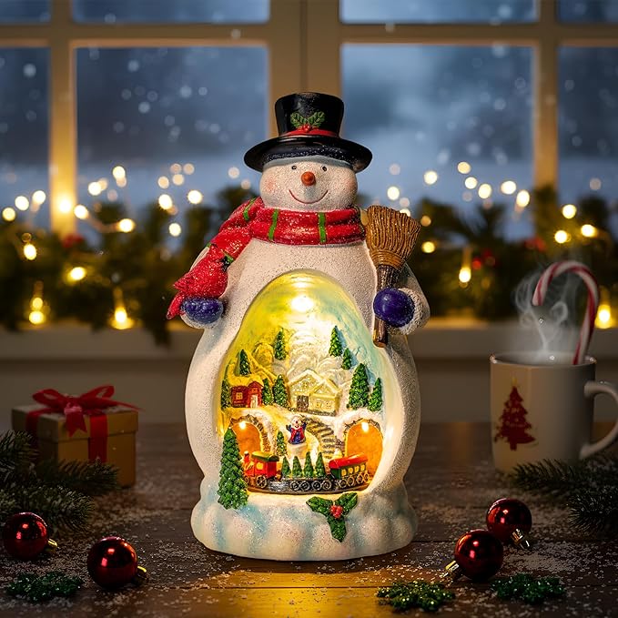 Snowman Figurine Lighted Christmas Village with Animated Rotating Train - Battery or USB Powered Snowman Decor Ornaments, LED Lights & Festive Music for Tabletop Home Holiday Collection Decorations