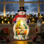 Snowman Figurine Lighted Christmas Village with Animated Rotating Train - Battery or USB Powered Snowman Decor Ornaments, LED Lights & Festive Music for Tabletop Home Holiday Collection Decorations