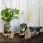 CVHOMEDECO. Wood Beads Garland with Tassels Farmhouse Rustic Wooden Prayer Bead String Wall Hanging Accent for Home Festival Decor. Gold Mix