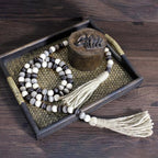 CVHOMEDECO. Wood Beads Garland with Tassels Farmhouse Rustic Wooden Prayer Bead String Wall Hanging Accent for Home Festival Decor. Black Grey Mix Distressed