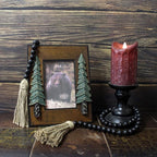 CVHOMEDECO. Wood Beads Garland with Tassels Farmhouse Rustic Wooden Prayer Bead String Wall Hanging Accent for Home Festival Decor. Black