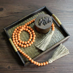 CVHOMEDECO. Wood Beads Garland with Tassels Farmhouse Rustic Wooden Prayer Bead String Wall Hanging Accent for Home Festival Decor. Orange